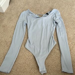 blue body suit with open back, worn once